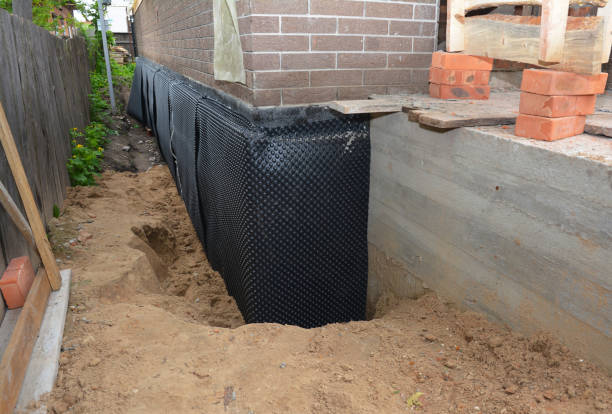 Happy homeowners after waterproofing job in Danville